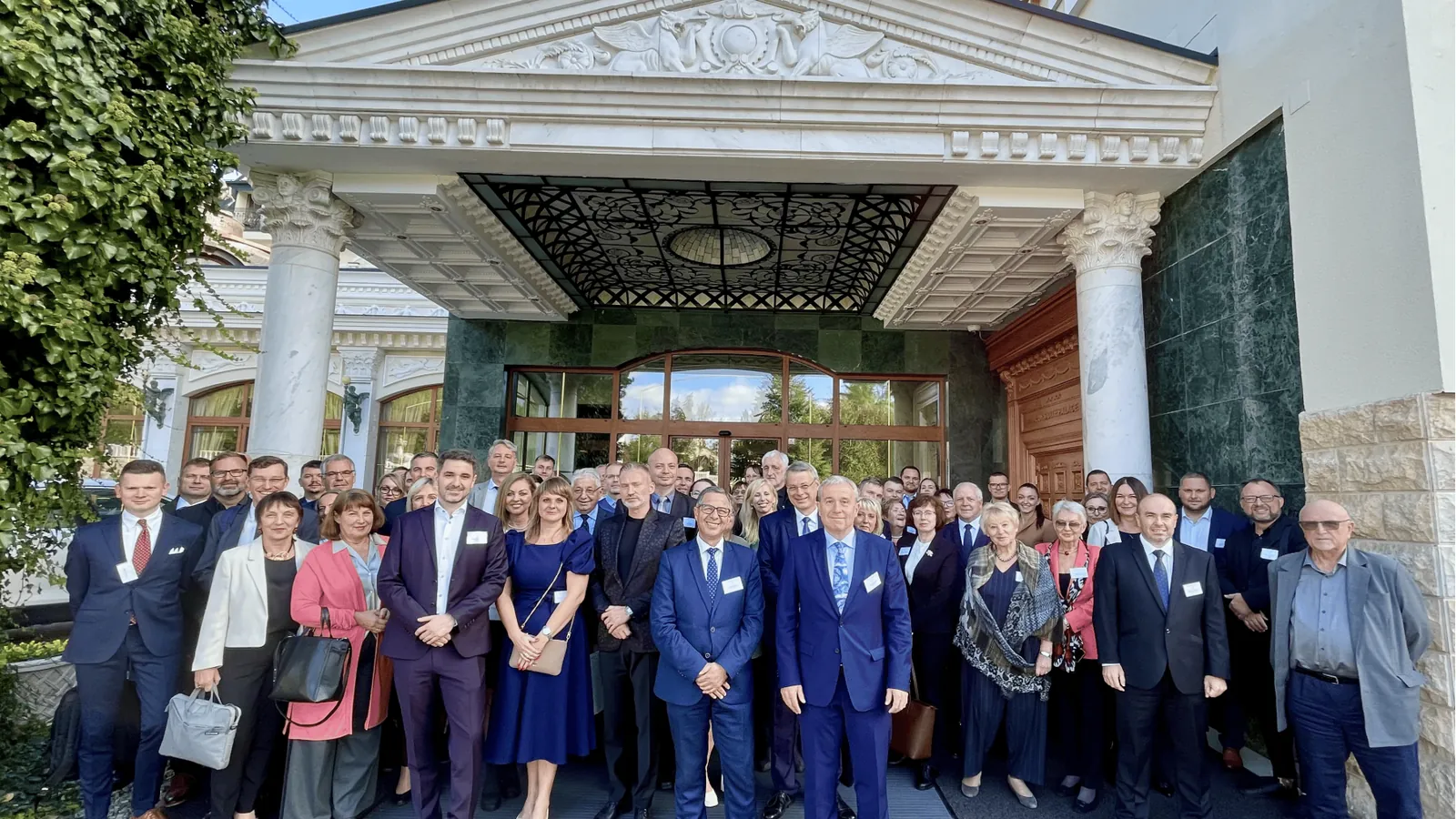 Conference attendees at the Aphrodite Palace entrance